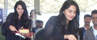 Exclusive Pics: Anushka cutting a cake in airport
