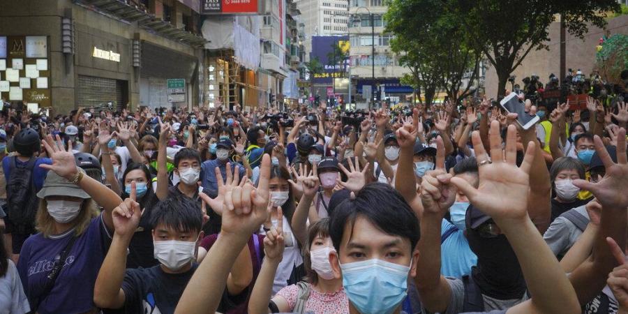 Hong Kong police arrest 8 people including districts councillors over peaceful protests