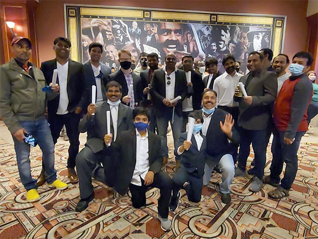 Pawan Kalyan fans in USA celebrate Vakeel Saab premiere in Lawyer dress