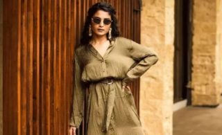 Chaitra Stuns in Brown Dress Hugs Curves Perfectly